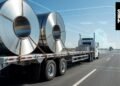 Autonomous Class 8 truck on a highway, illustrating driverless freight moving into commercial operation in 2026